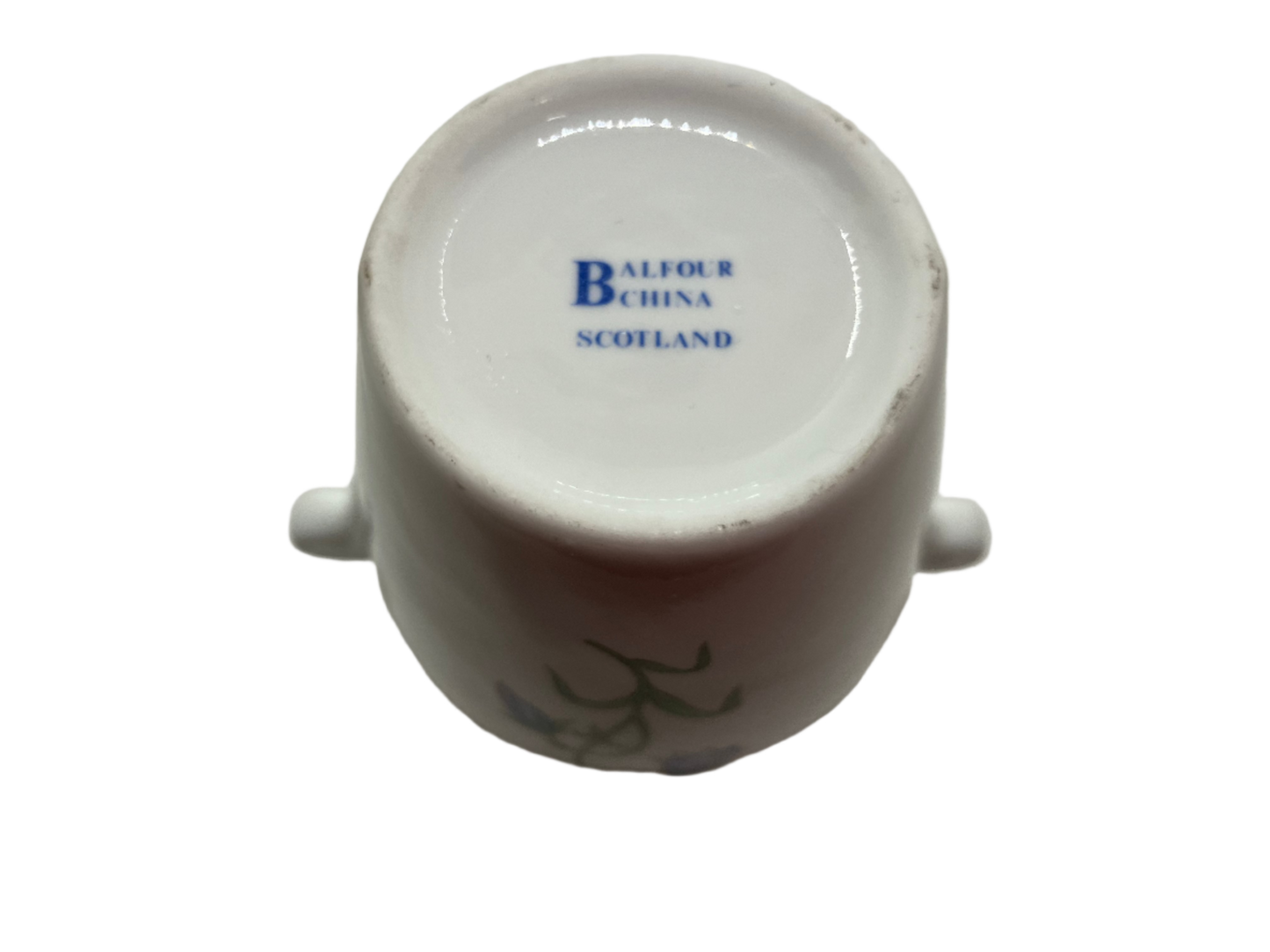 Close-up of a white ceramic product with 'Ballina Scotland' branding