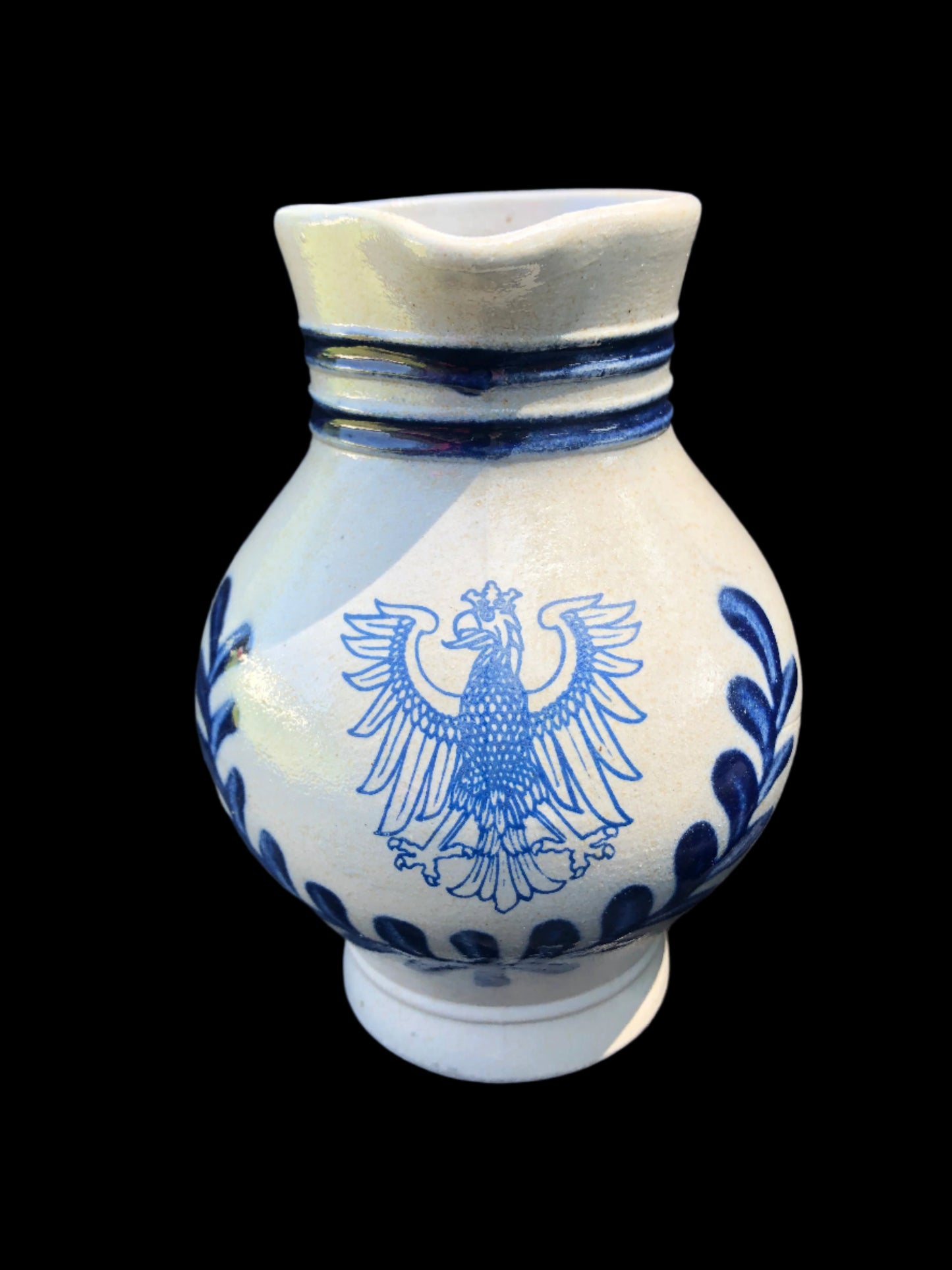 Eagle crest pitcher with blue accents that is a Frankfurt souvenir