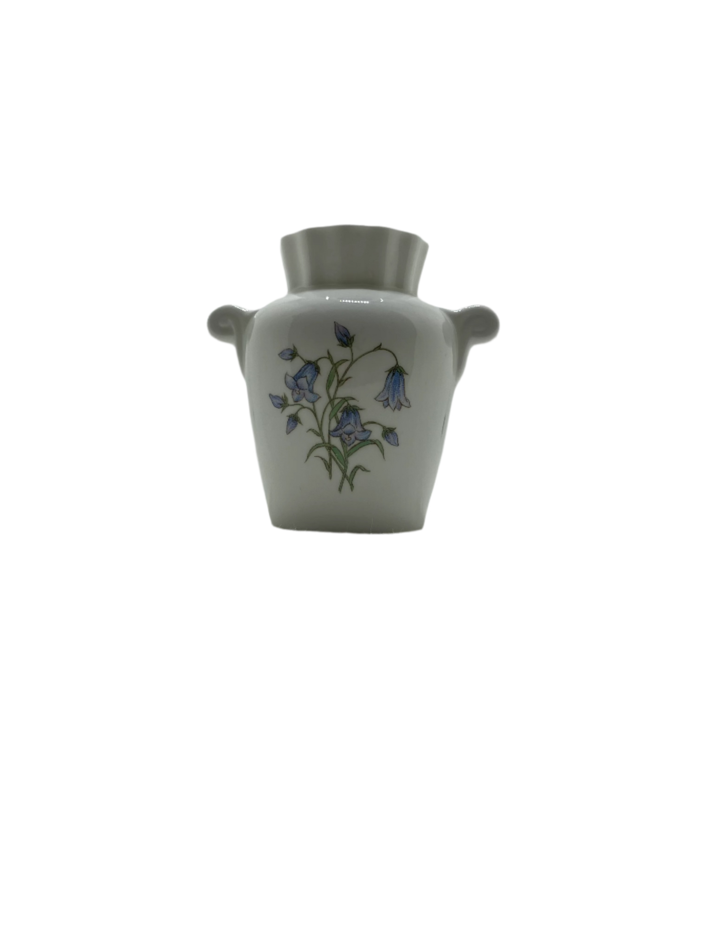 Small white vase with floral design on a white background