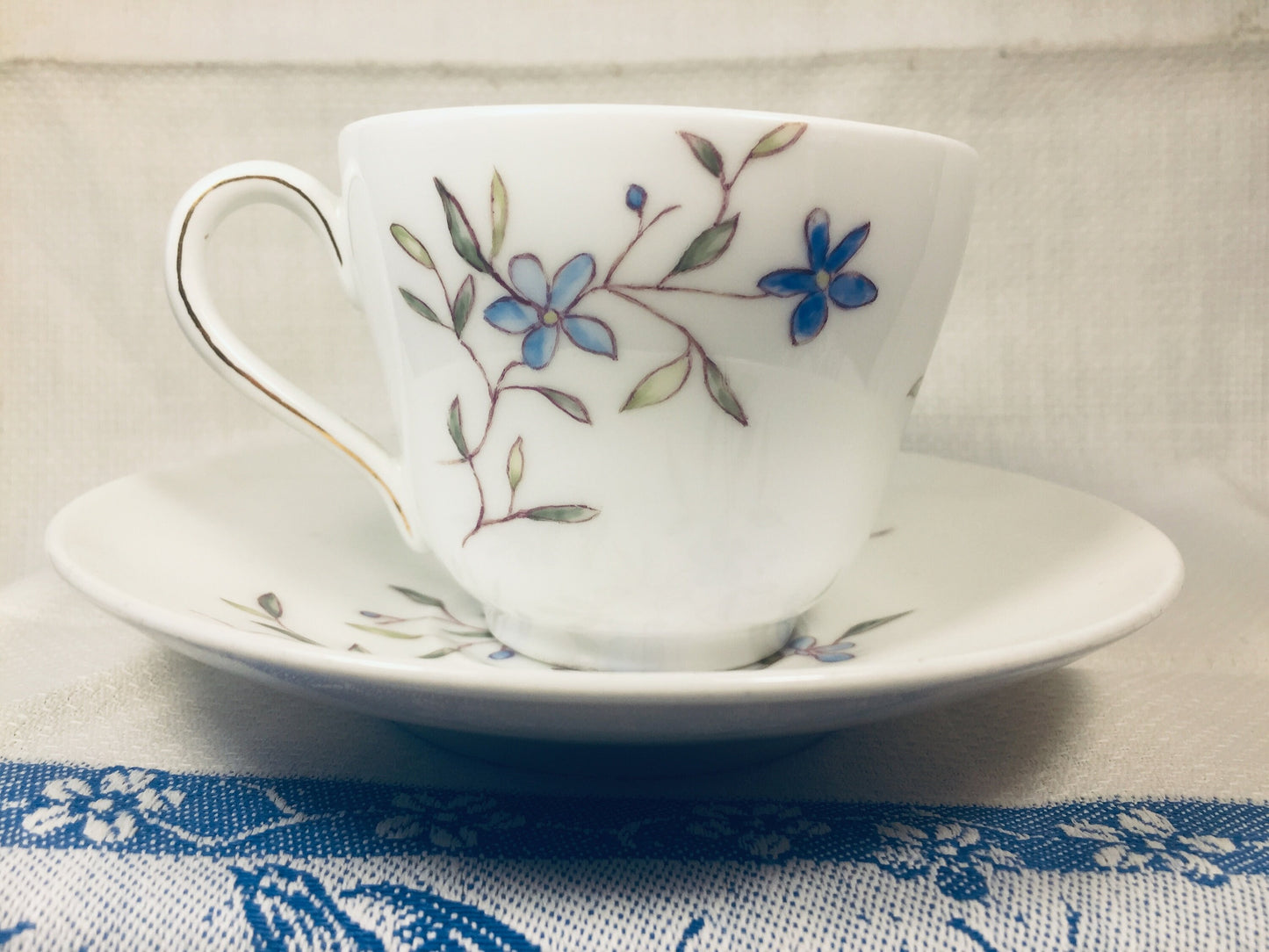 Beautiful Blue and White Floral Cup and Saucer Signed