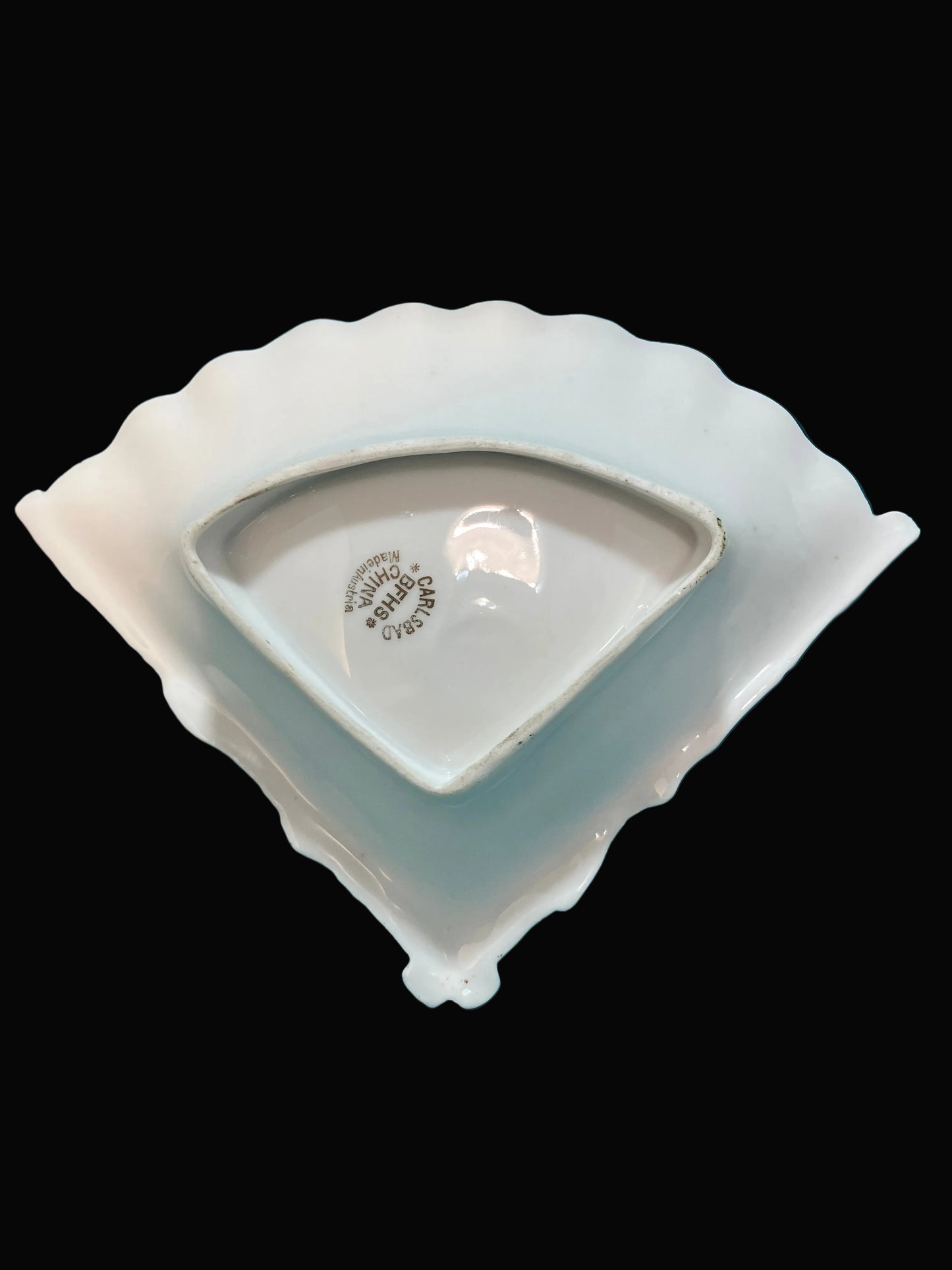 White ceramic fan shaped dish with scalloped edge 