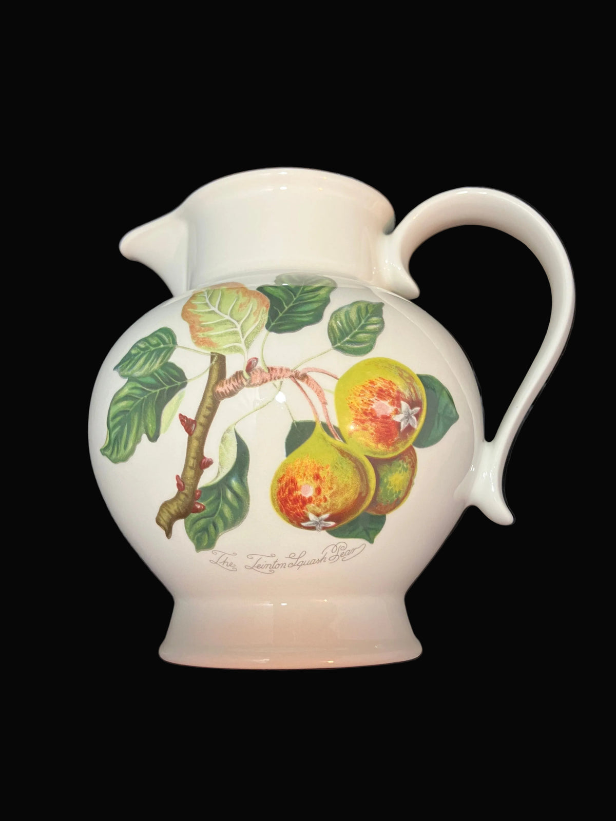 A white ceramic pitcher decorated with an illustration of green leaves and two pears on a branch.
