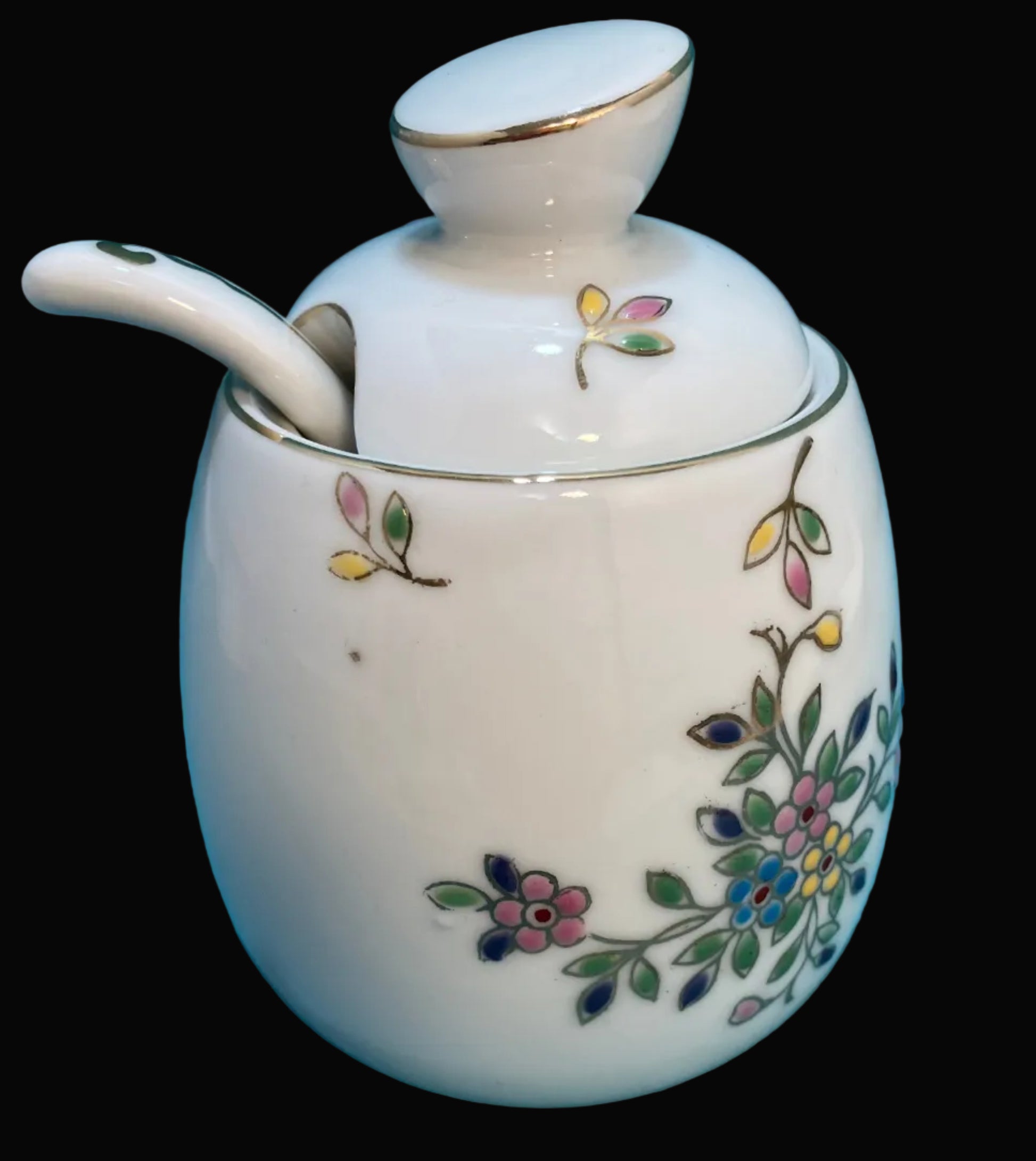 White ceramic jar with floral designs 