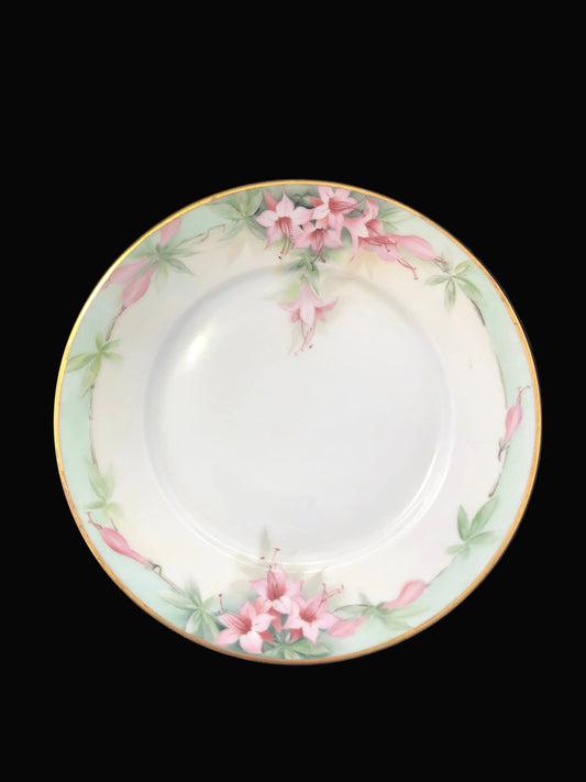 Decorative plate with floral design on a black background