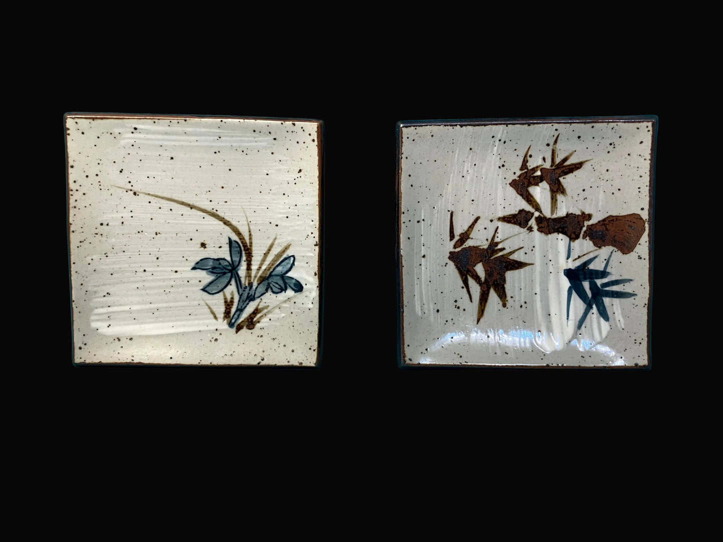 square sushi plates with bamboo and floral designs