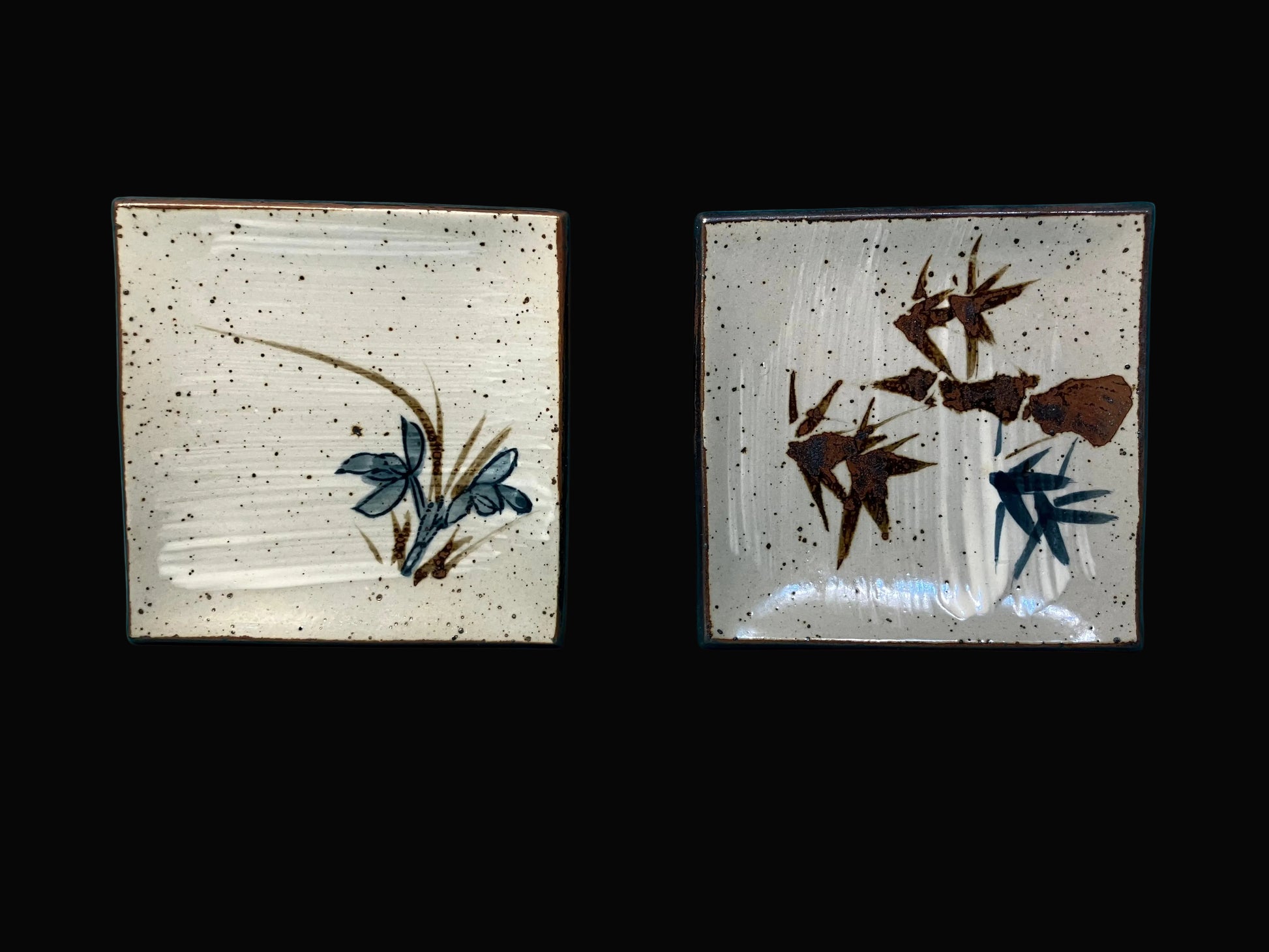 square sushi plates with bamboo and floral designs