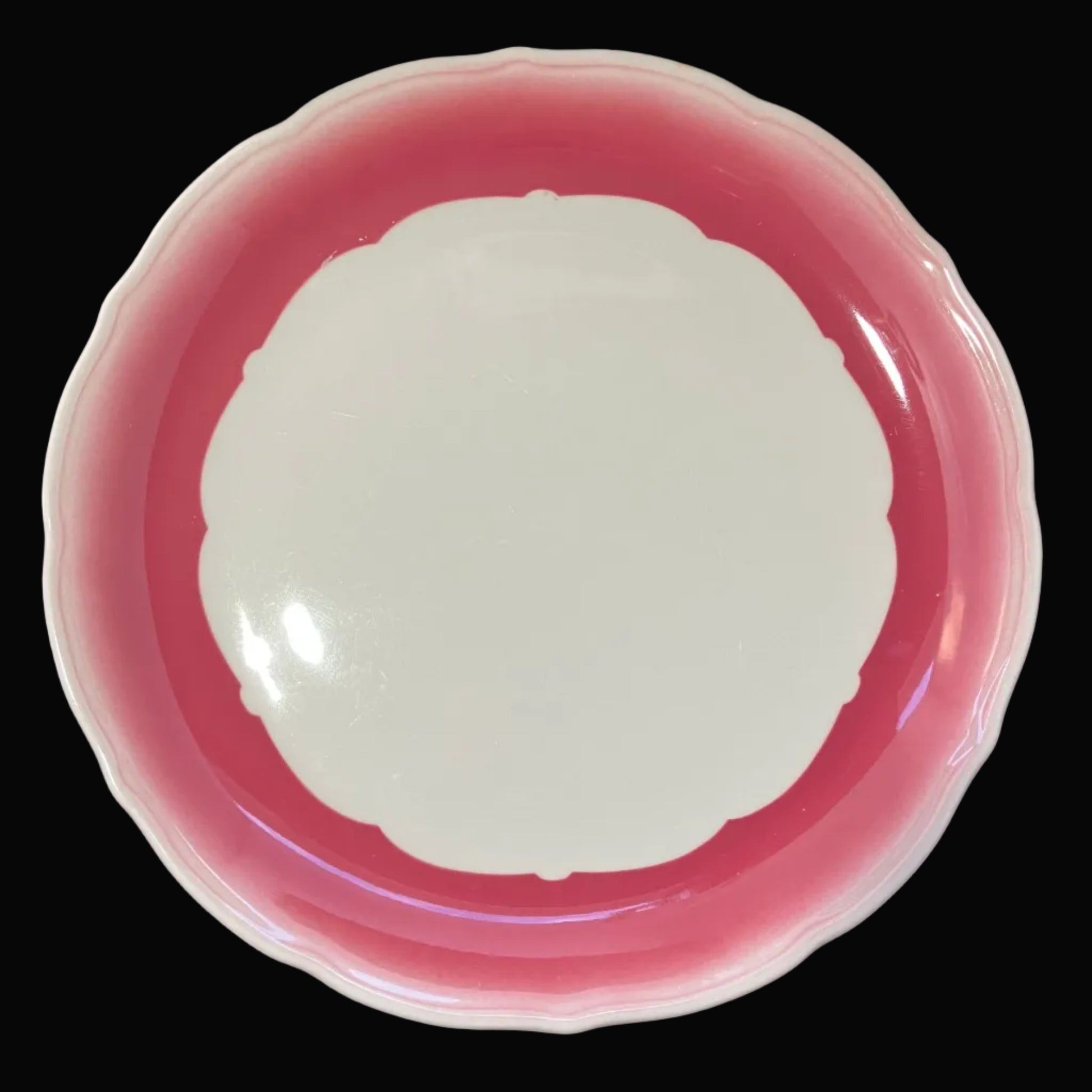 Pink ceramic plate with white interior 