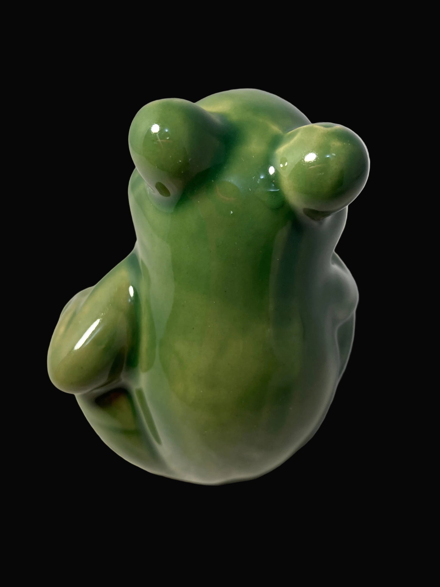 small ceramic figurine of a frog