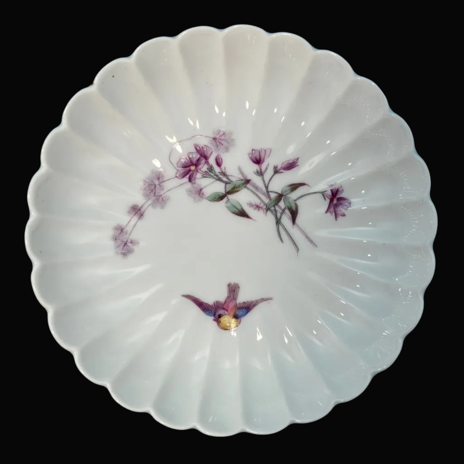 Decorative white bowl with floral and bird design 