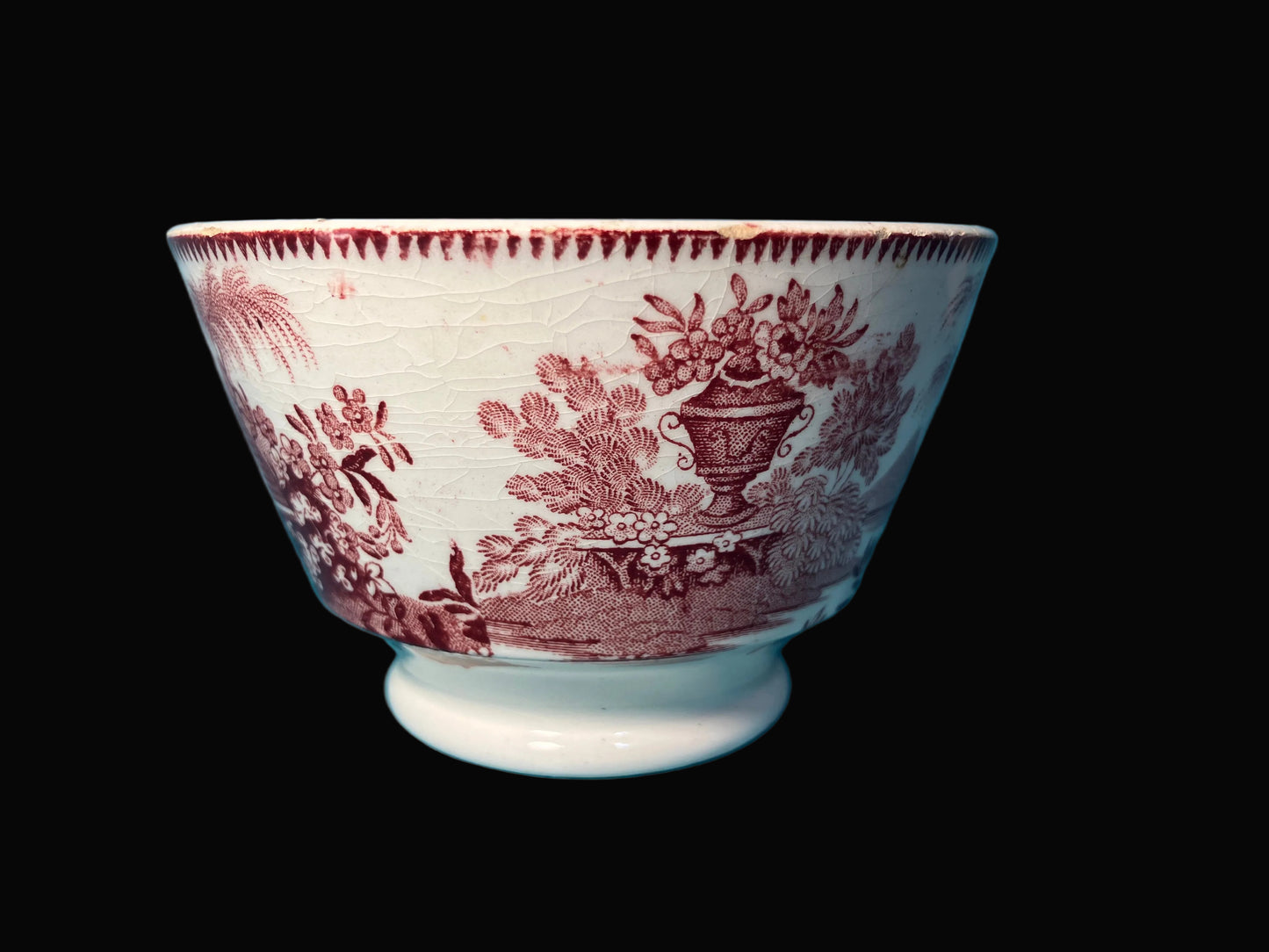 White ceramic bowl with red floral pattern