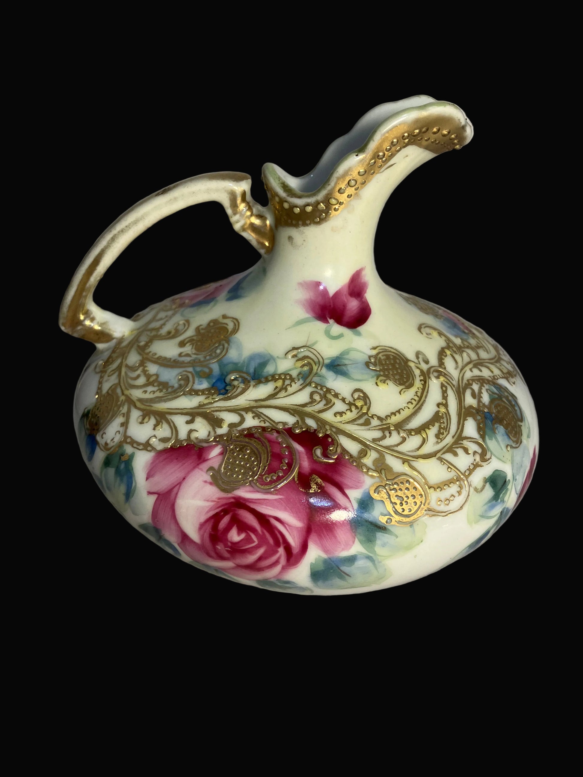 Antique Nippon porcelain pitcher with 
hand painted roses