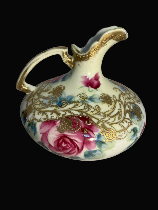 Antique Nippon porcelain pitcher with 
hand painted roses