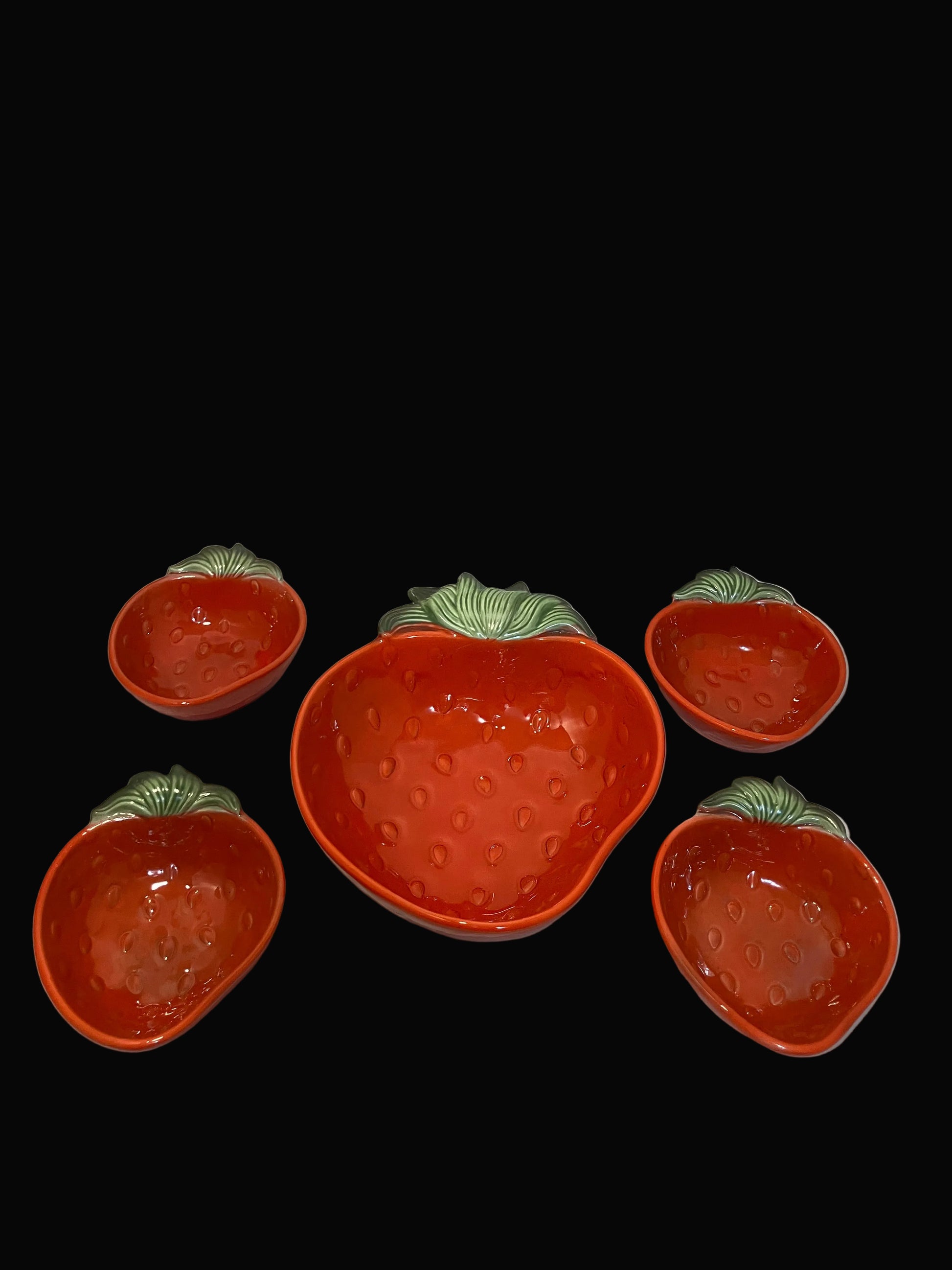 Set of five strawberry-shaped ceramic bowls with green stems