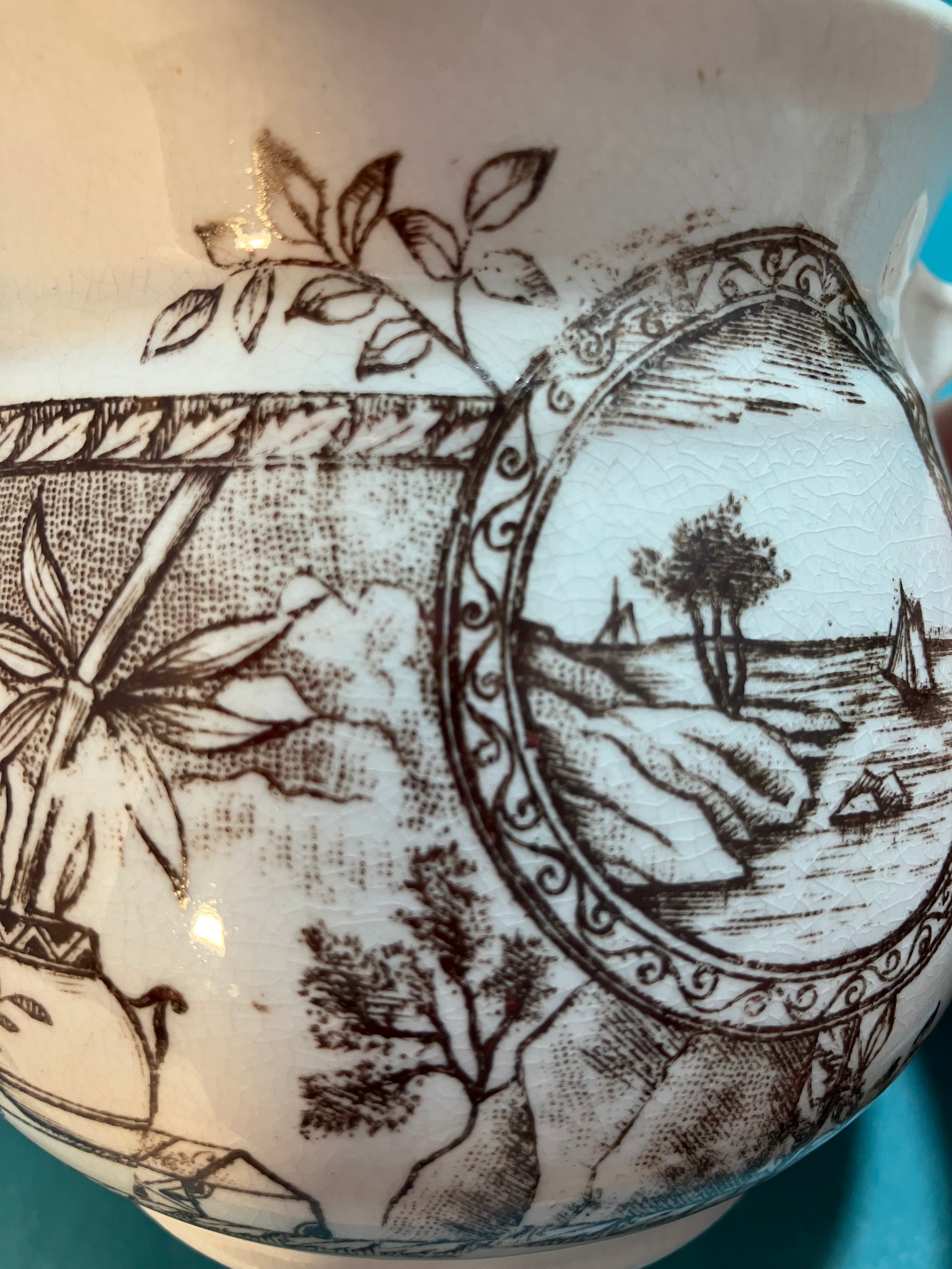 Decorative ceramic item with intricate brown and white design on a beige background