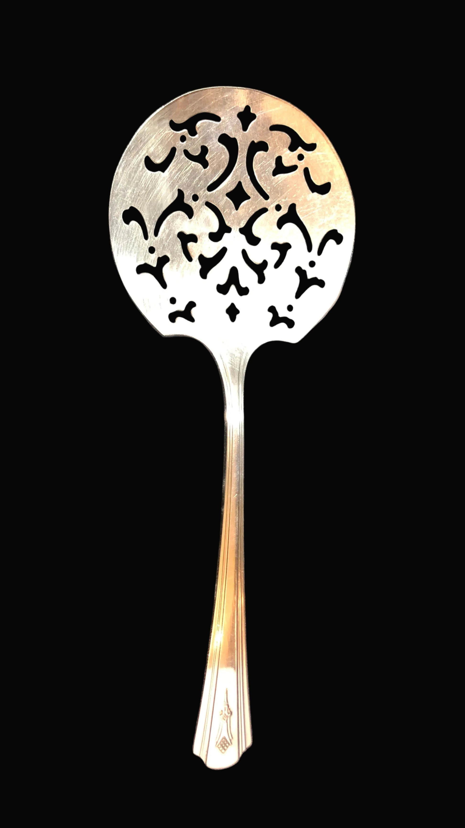 Decorative metal spoon on a black  background