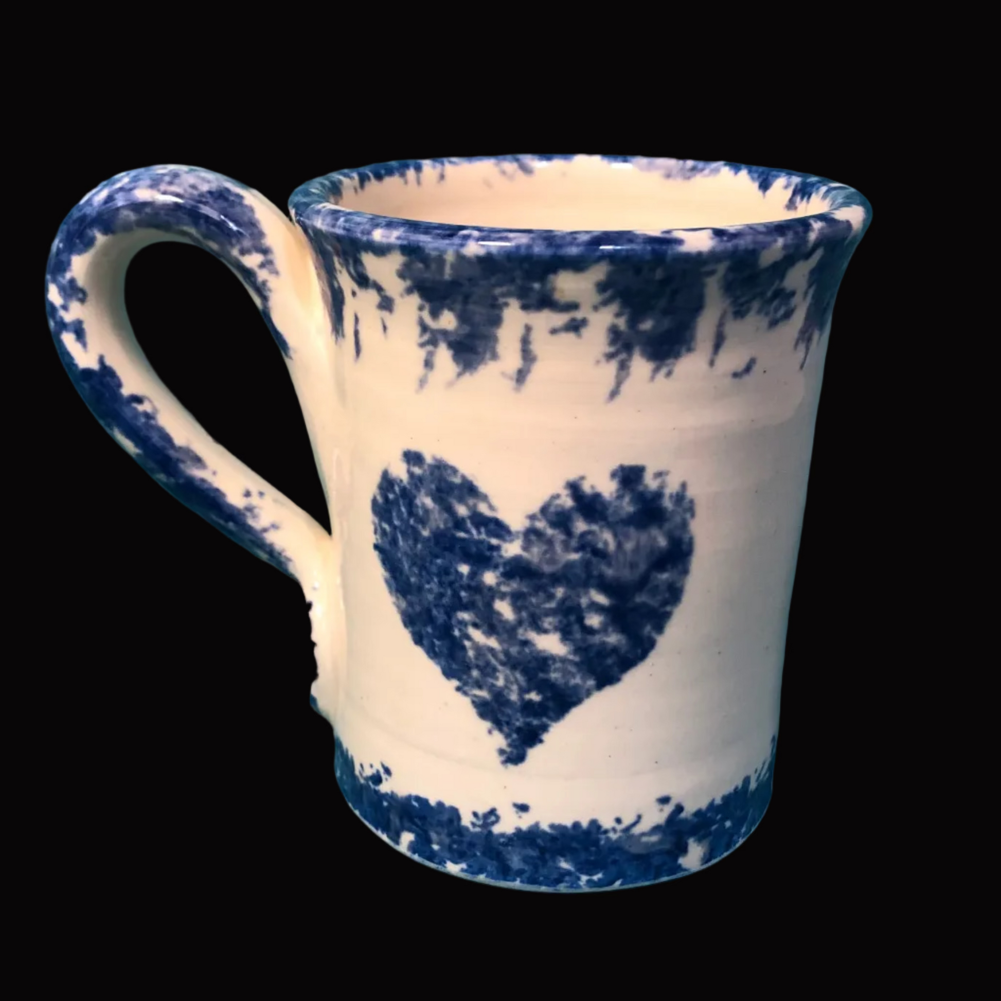 Ceramic mug with blue heart design on one side and cat on the other