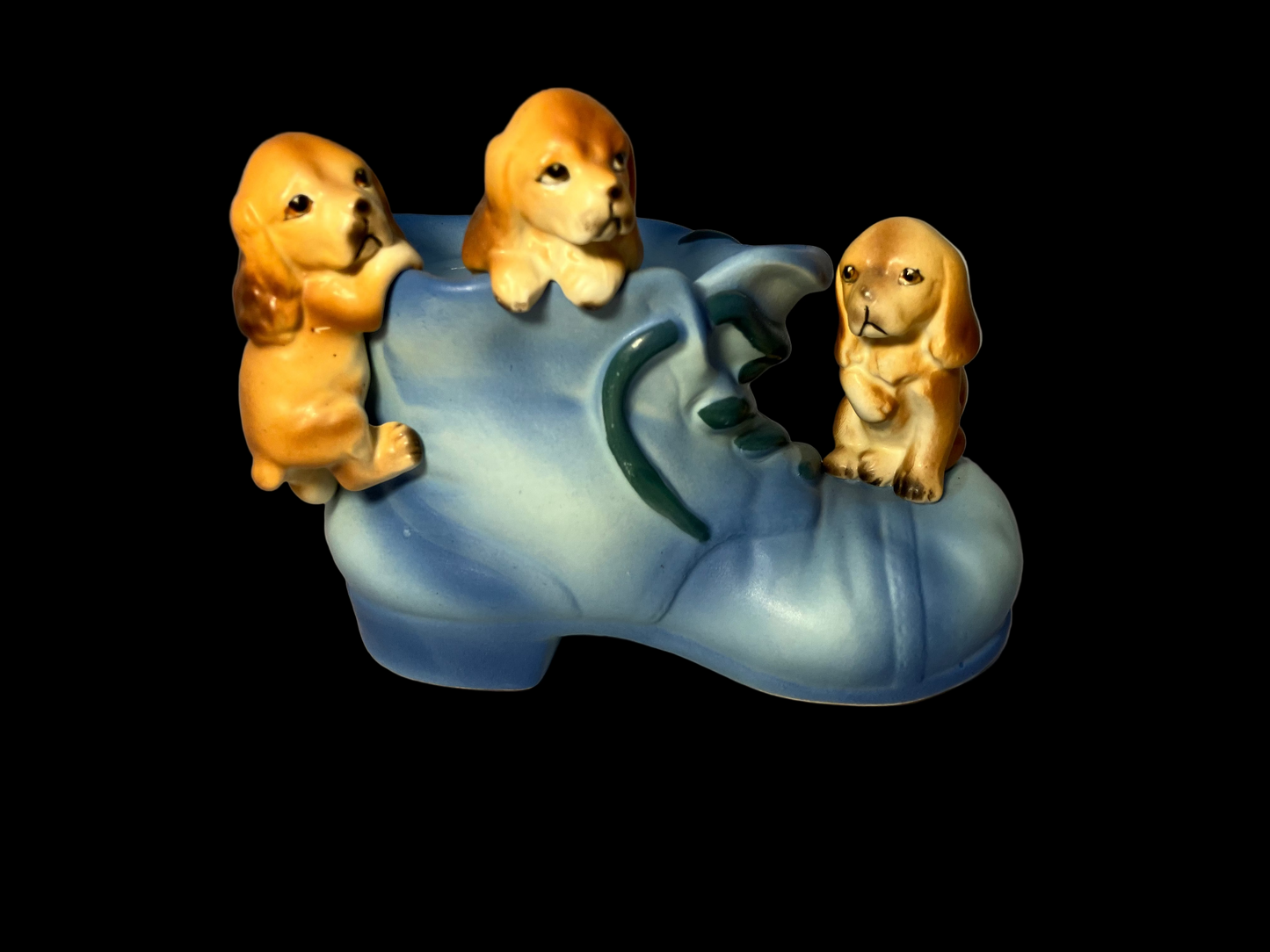 Ceramic shoe bank with three dog/puppy figures