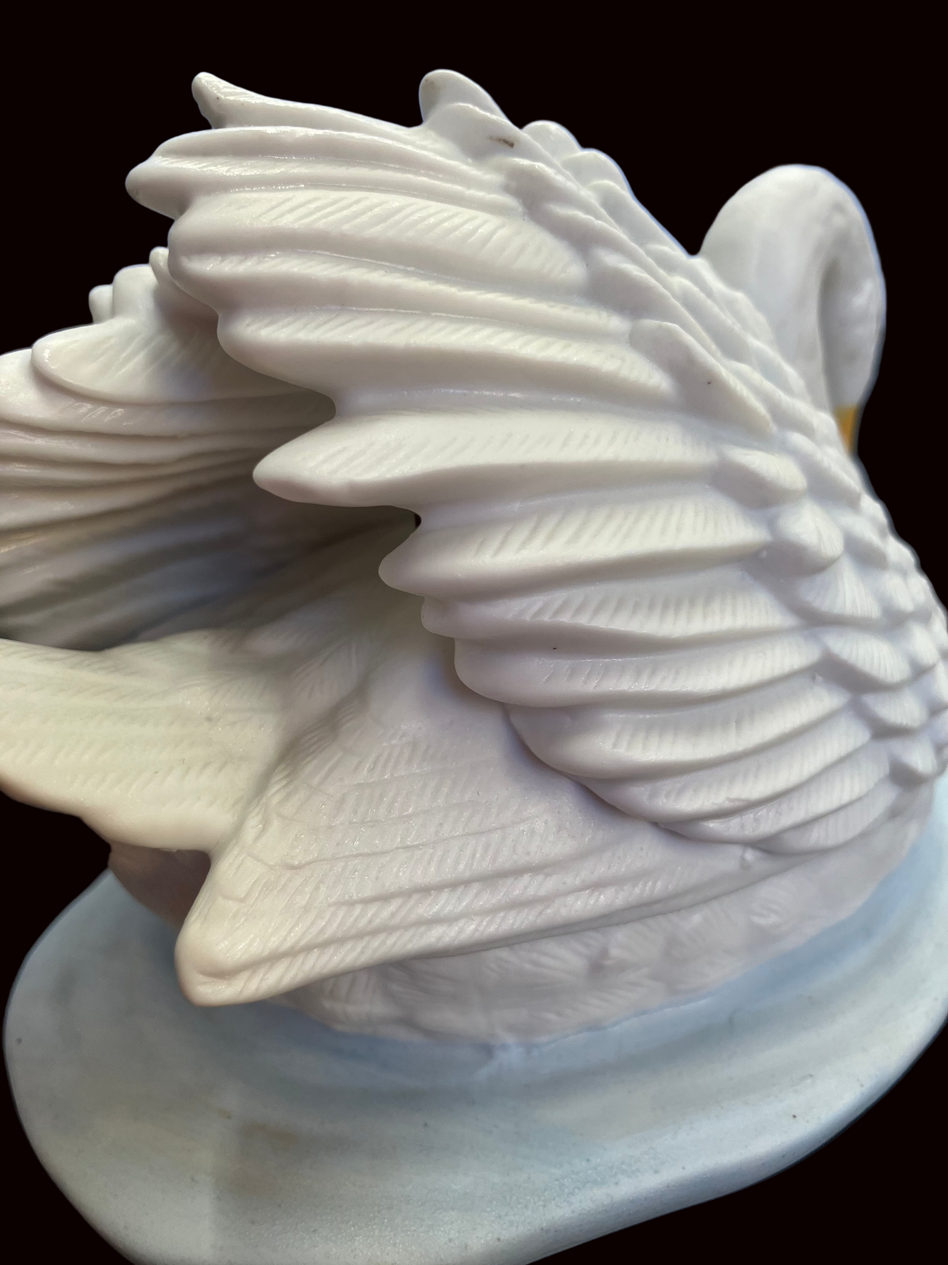 Ceramic swan by HUMCO with raised wings and detailed plumage 