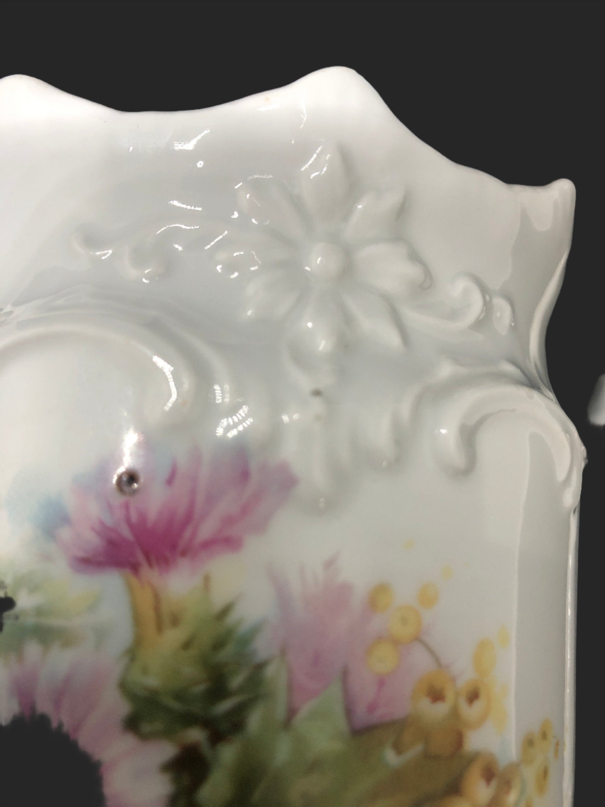 Cottage Core vintage porcelain pitcher embossed design close up 