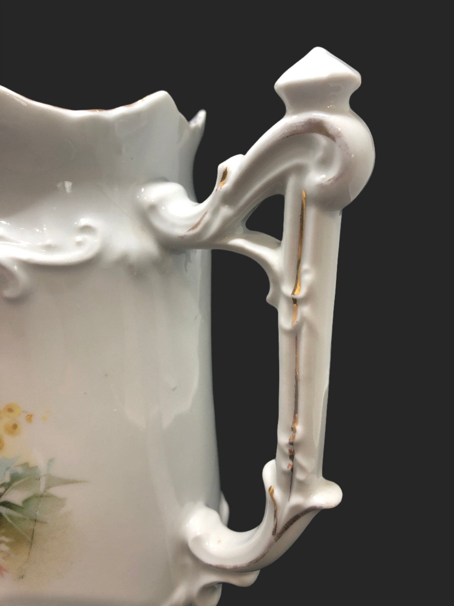 Cottage Core vintage porcelain pitcher ornate handle close up