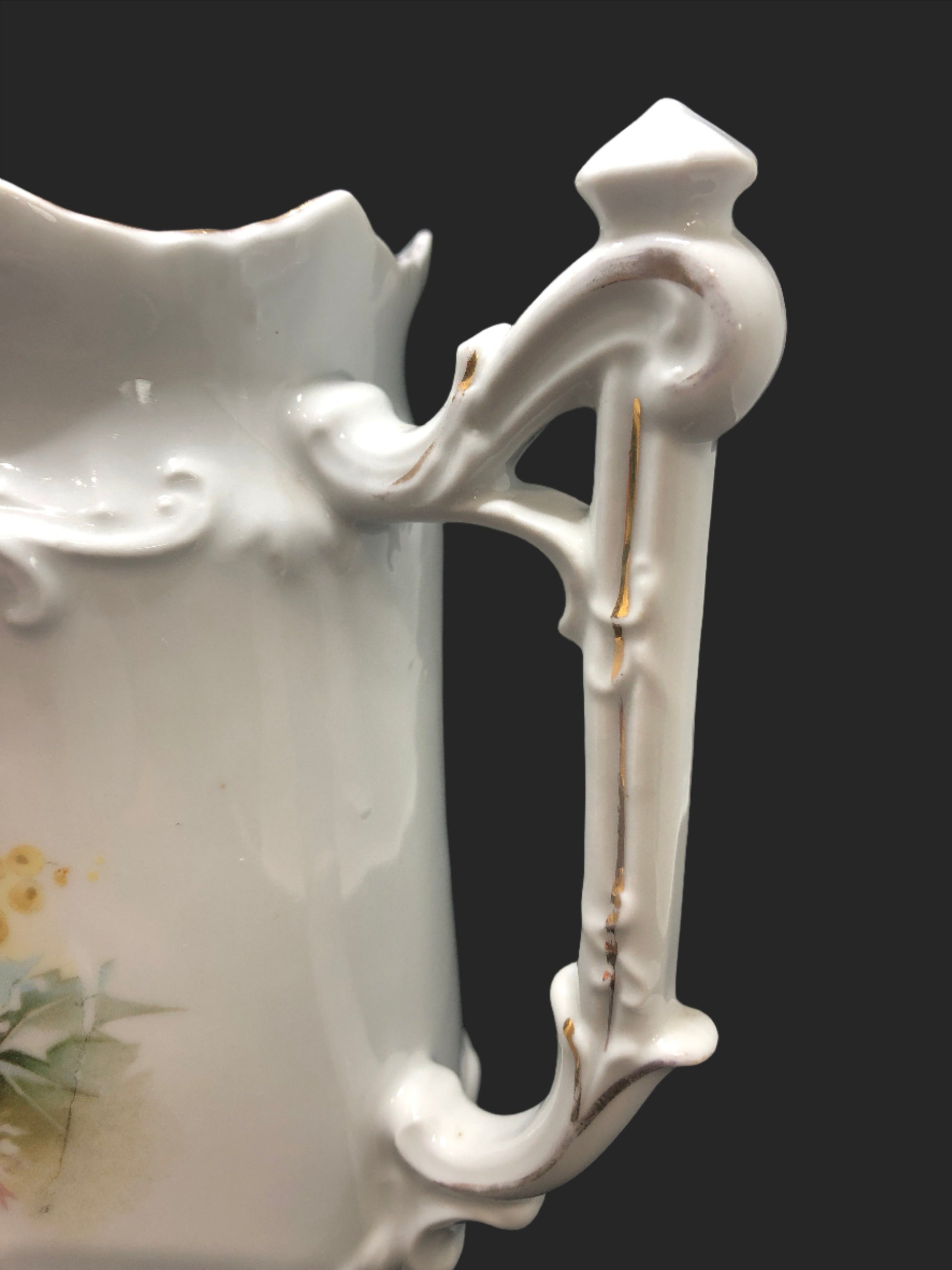 Cottage Core vintage porcelain pitcher ornate handle close up