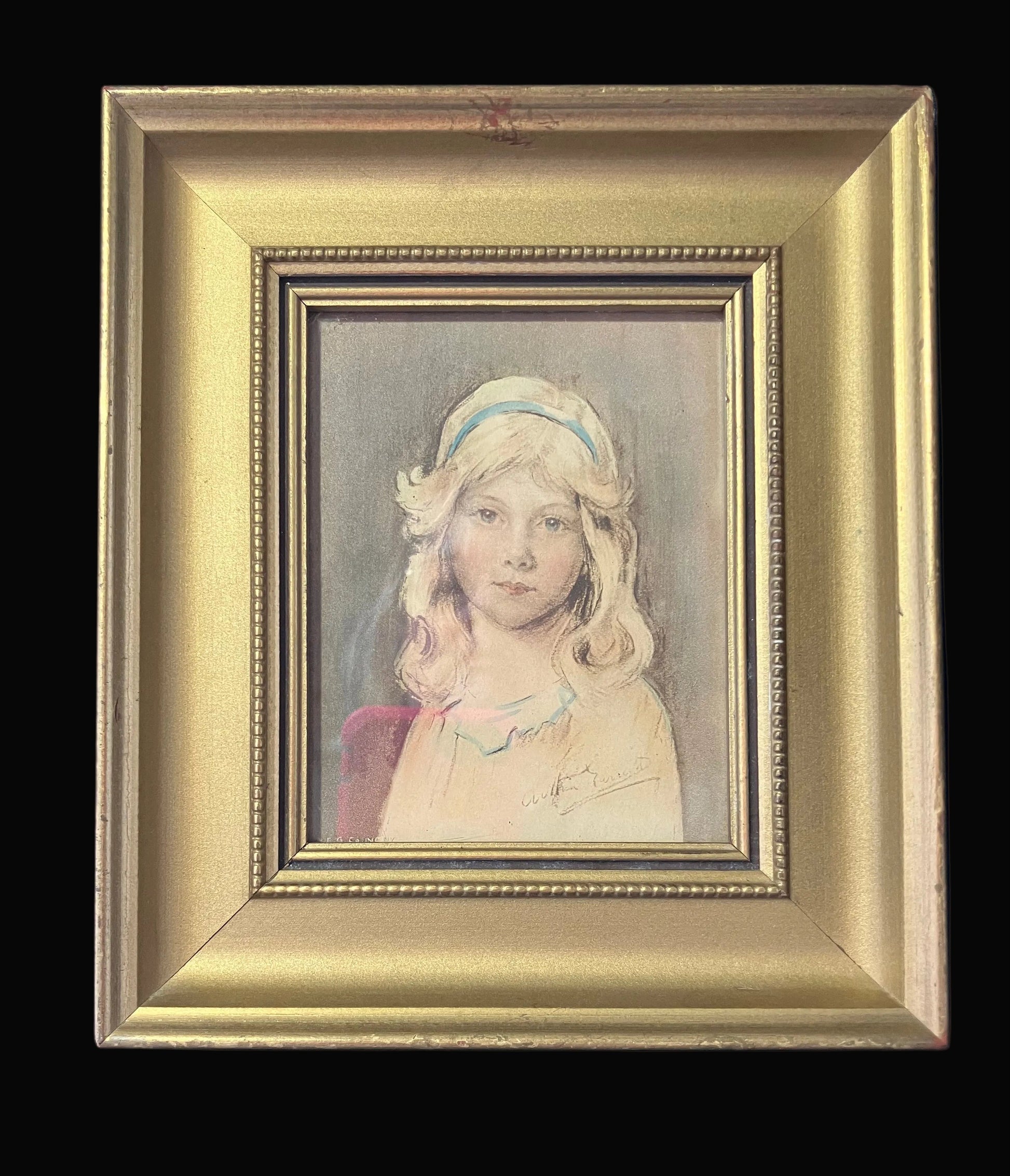 Framed portrait of a young girl with a decorative headband on a black background