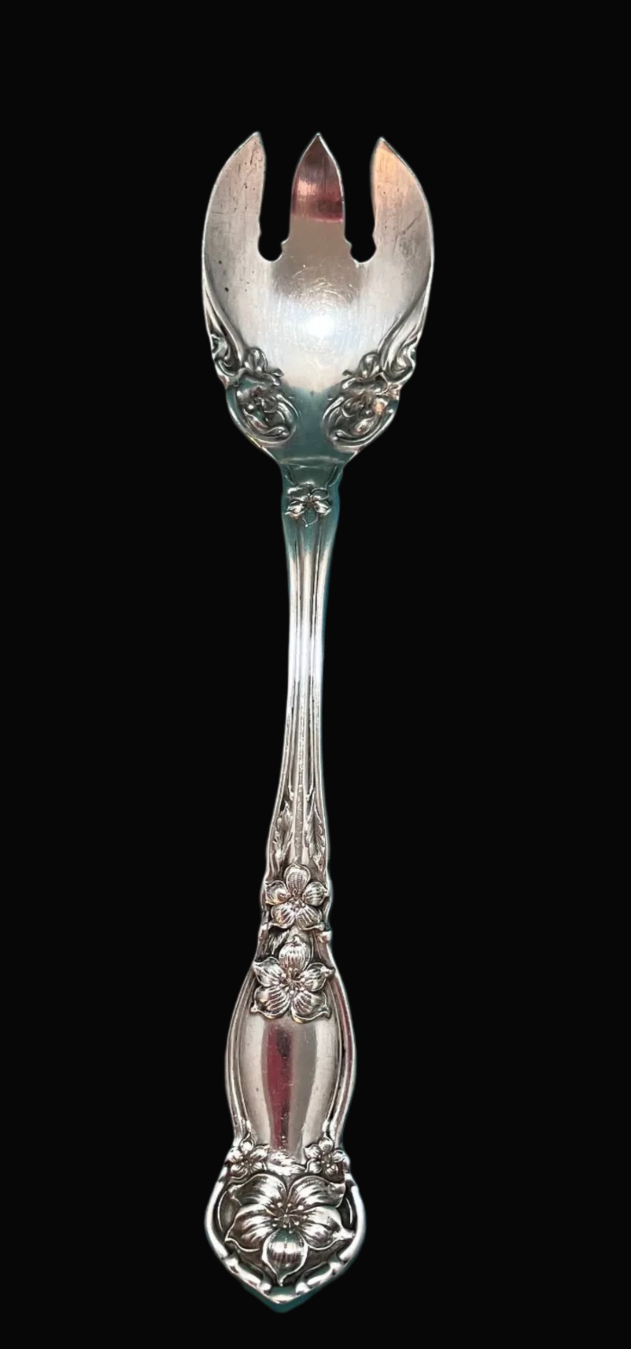 Antique silverplate dessert spoon made by Rogers