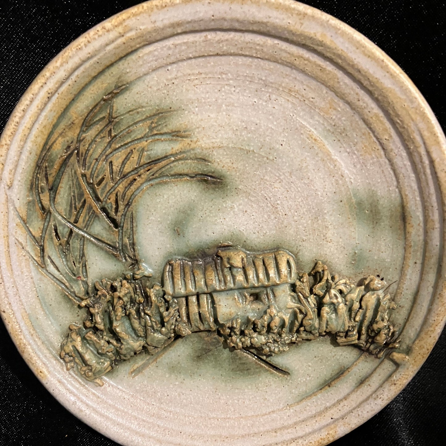 Cottage landscape scene 
Round wall plaque