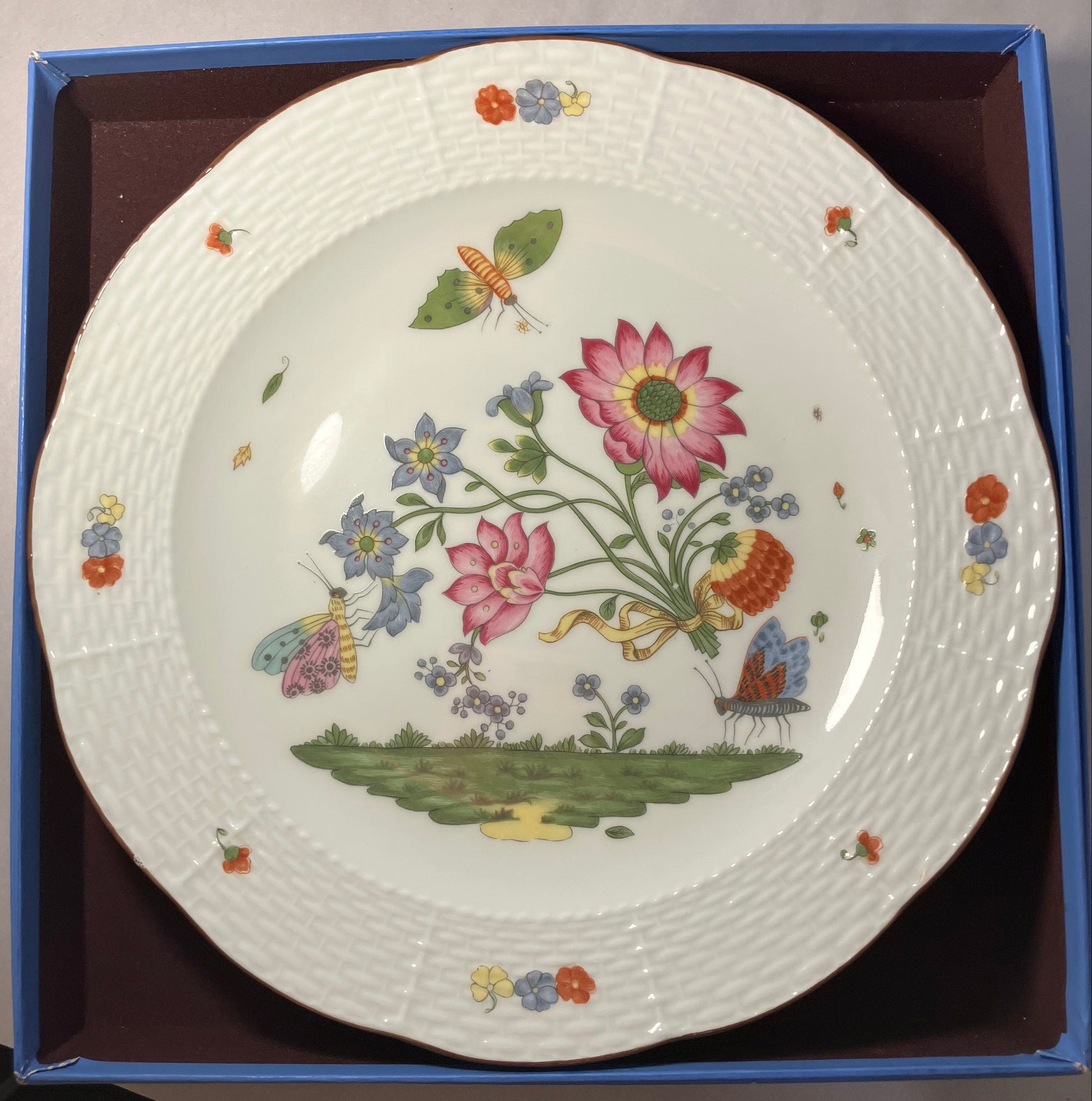 Decorative plate with floral and butterfly design in a box