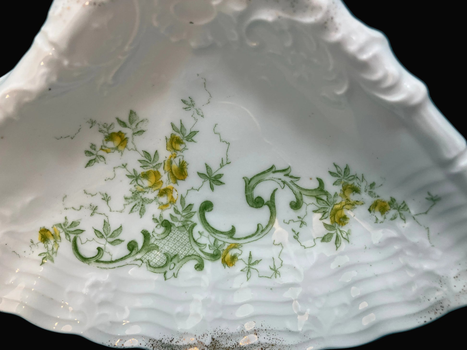 Close-up of a decorative ceramic dish with floral patterns 