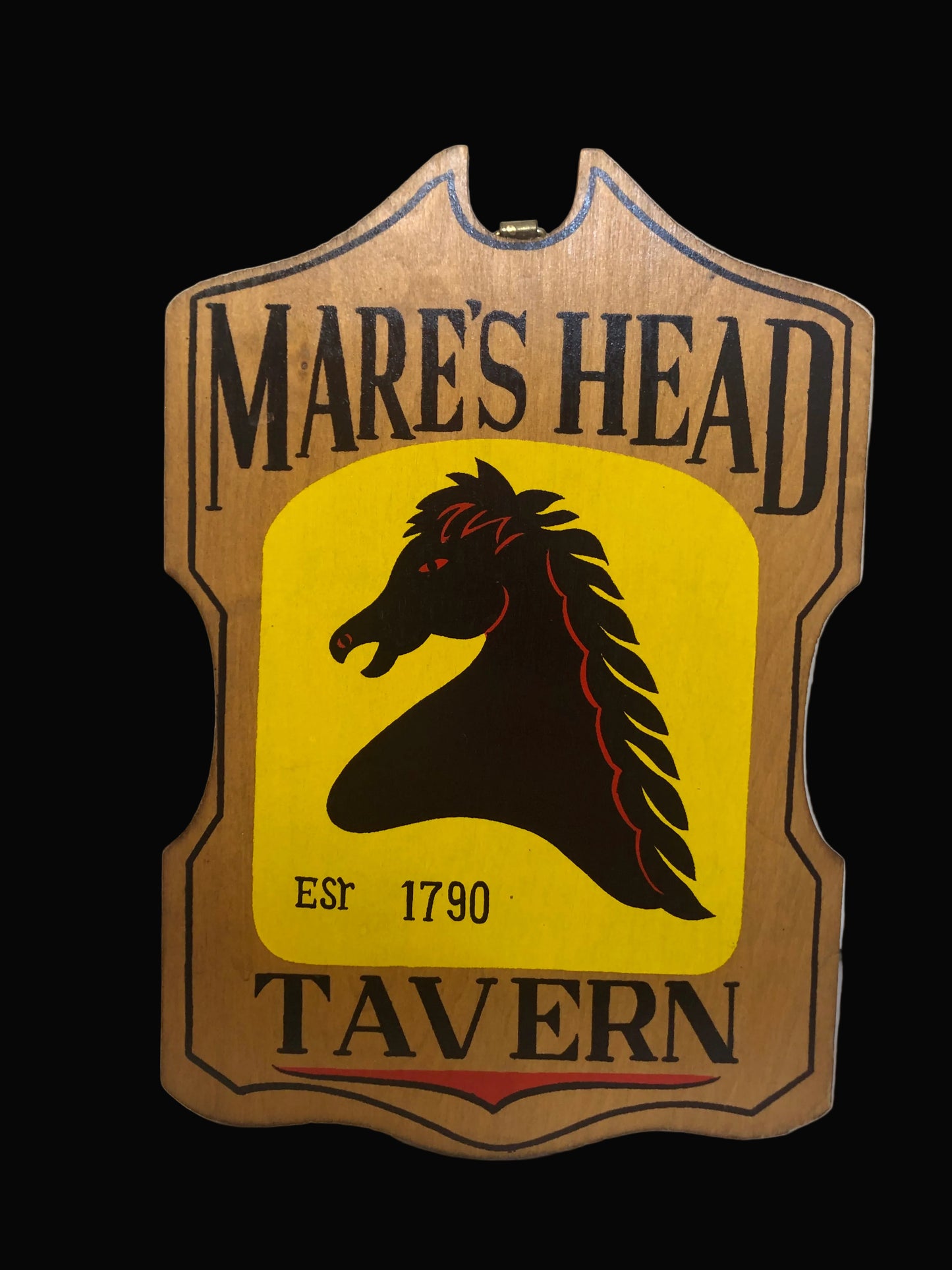 Mare's Head Tavern sign with a horse head logo on a yellow background
