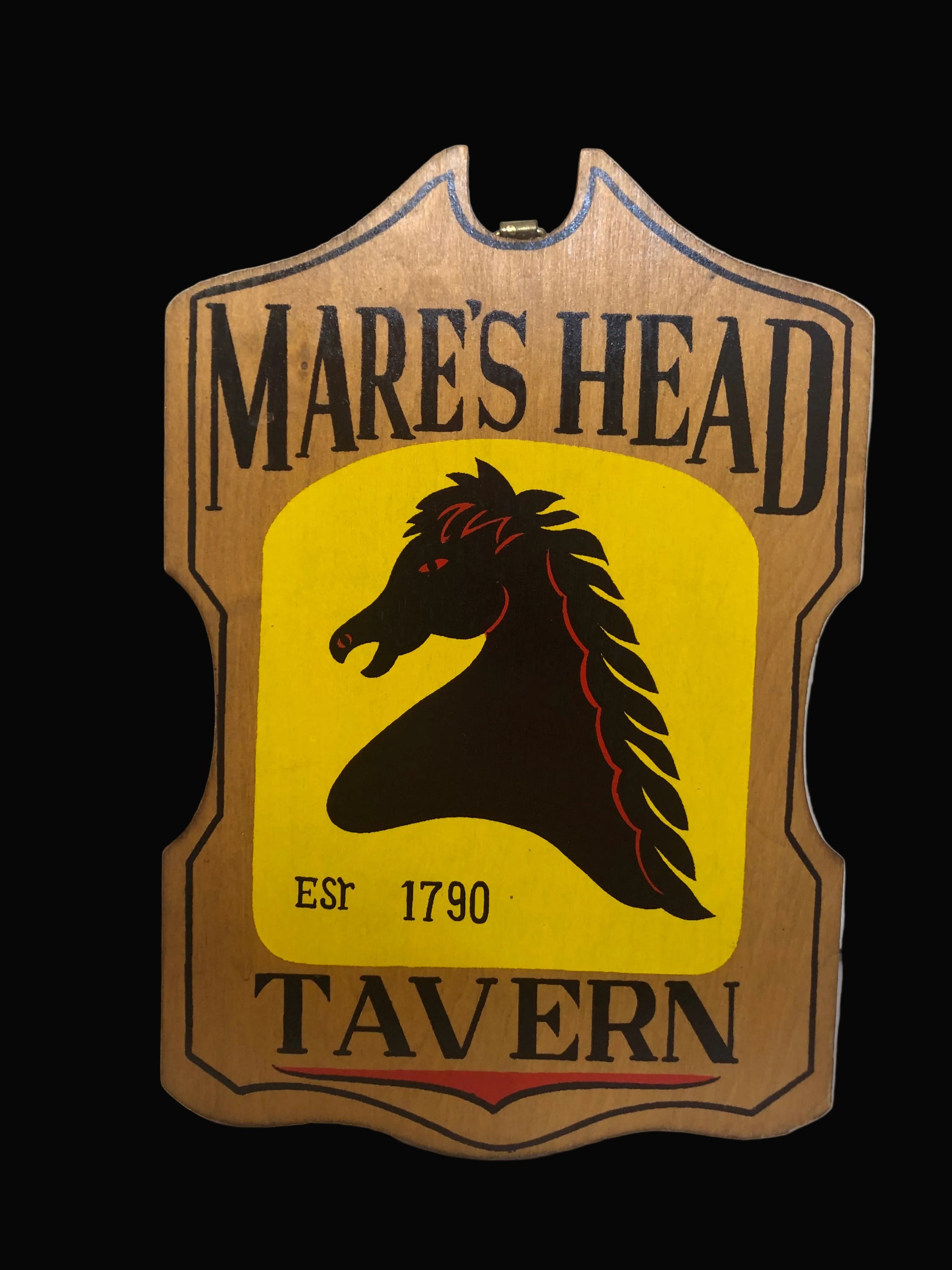 Mare's Head Tavern sign with a horse head logo on a yellow background