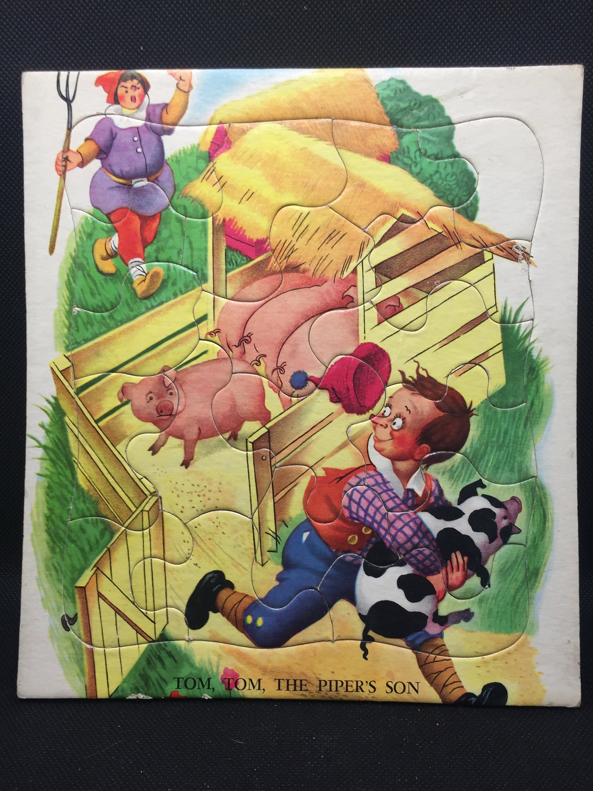 Mid Century "Tom, Tom, the Piper's Son" child's puzzle with pigs