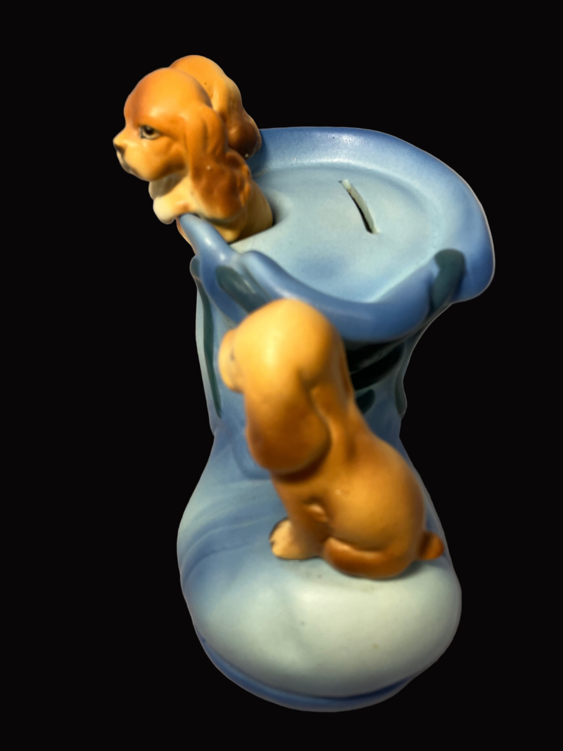 Vintage puppy bank featuring three puppies in a shoe