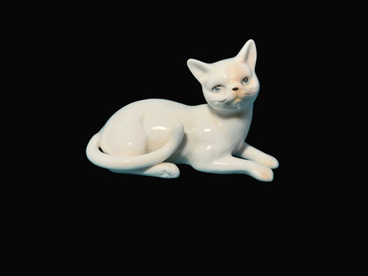 White ceramic cat figurine 